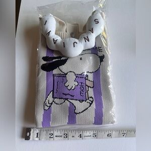 Mini hand carried and strap comes with it, fits phone and cards